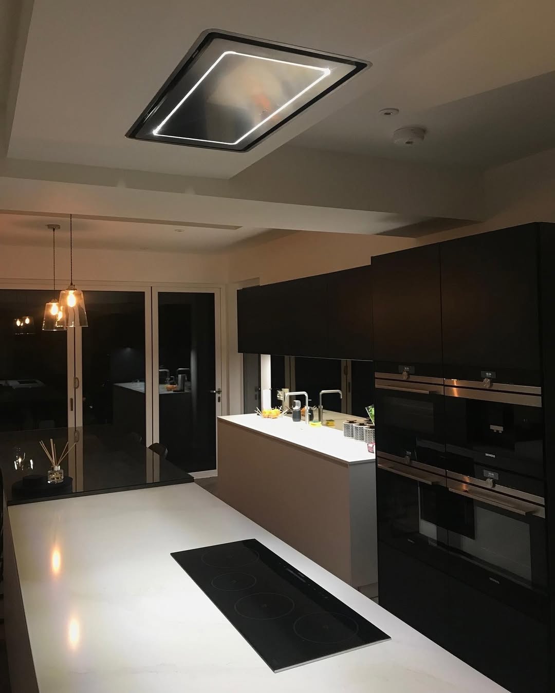 How_beautiful_is_this_kitchen_featuring_our_High-light_ceiling_hood!The_lighting_certainly_adds_.jpg